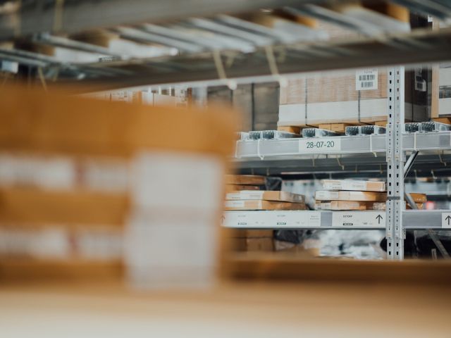 Boxes stacked on warehouse shelves