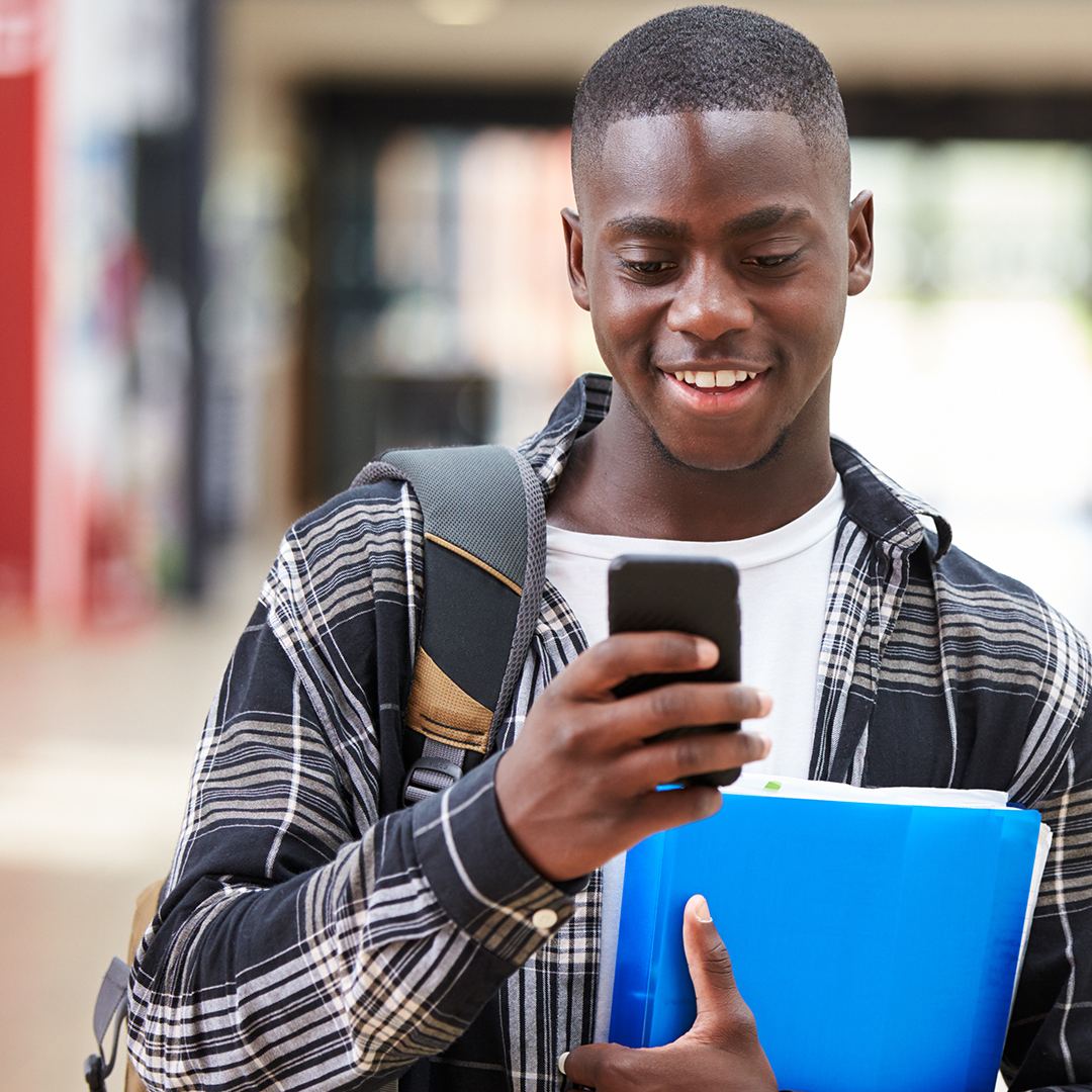 Student on his phone for the education page